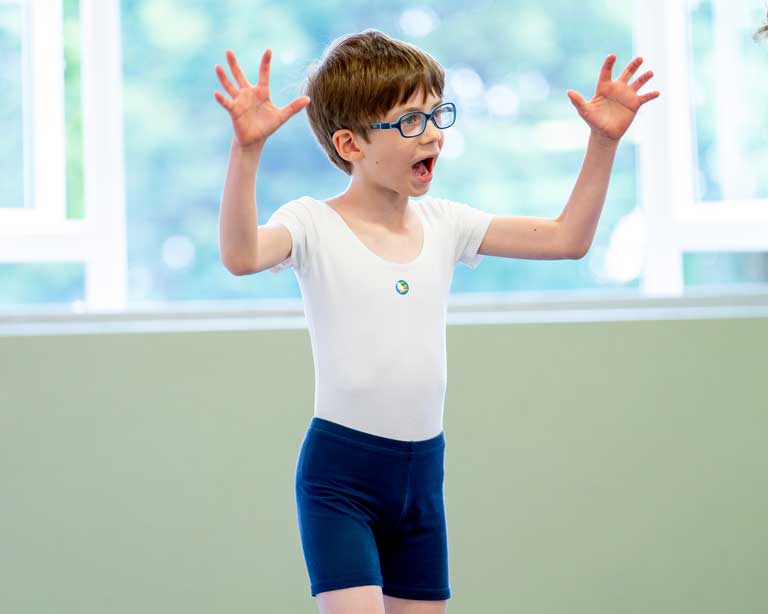 A youngster having fun and participating in a Dan Tien workshop